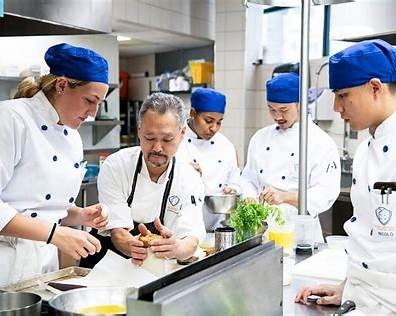 Students receiving practical culinary skill development training